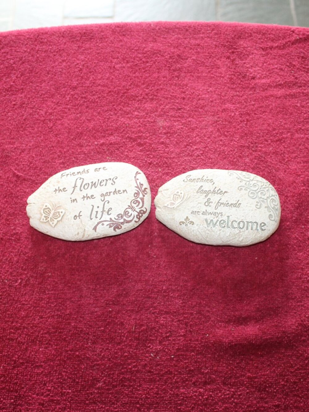 Two decorative, light-colored stone garden plaques - Friendship
